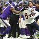The Bears’ Damien Williams stiff arms the Vikings’ Patrick Peterson in the second half of the game at U.S. Bank Stadium on January 09, 2022 in Minneapolis.